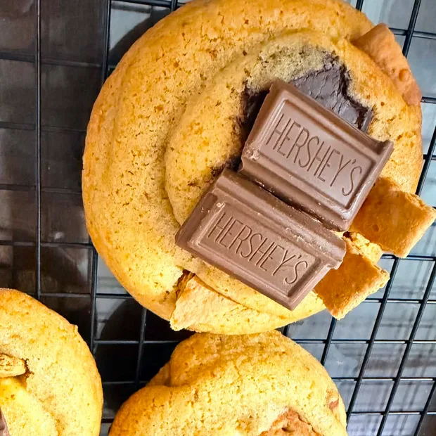 S'mores cookies topped with chocolate bars and graham crackers
