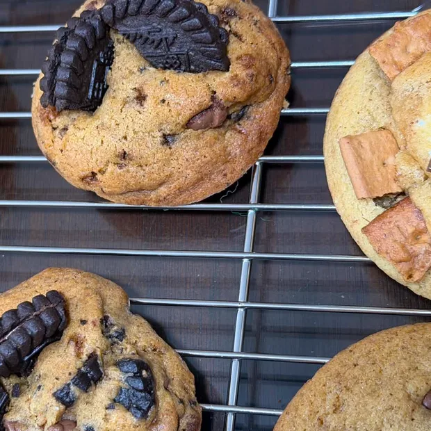 A fresh batch of cookies cooling on a rack